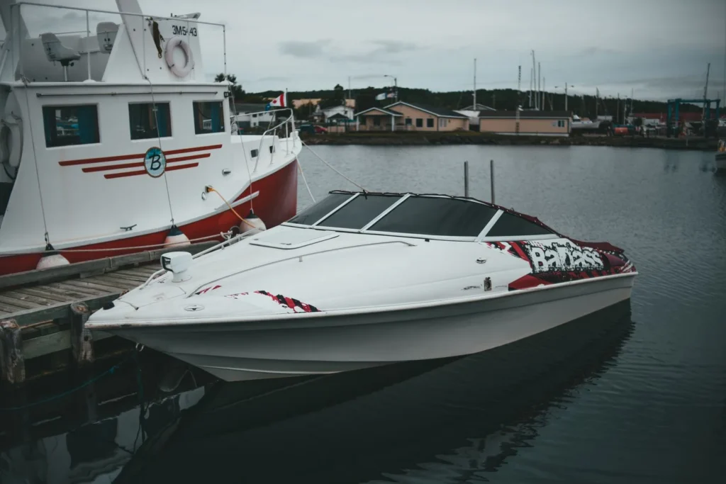Boat signs Austin - a professionally lettered boat docked at a Central Texas marina
