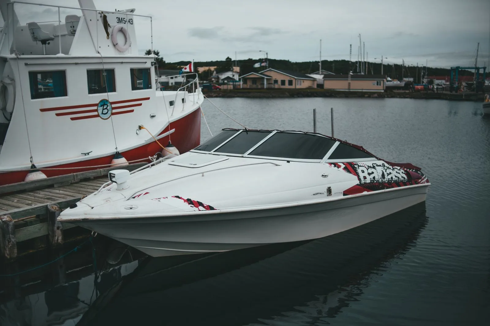 Boat signs Austin - a professionally lettered boat docked at a Central Texas marina