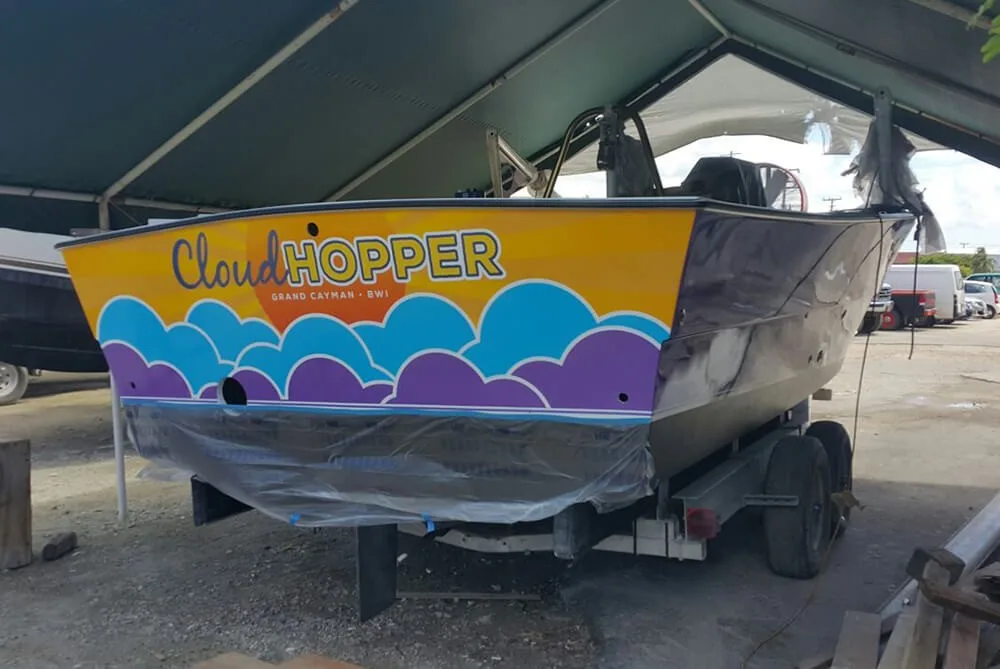 Custom boat name and homeport lettering installed on a boat transom near Austin, Texas
