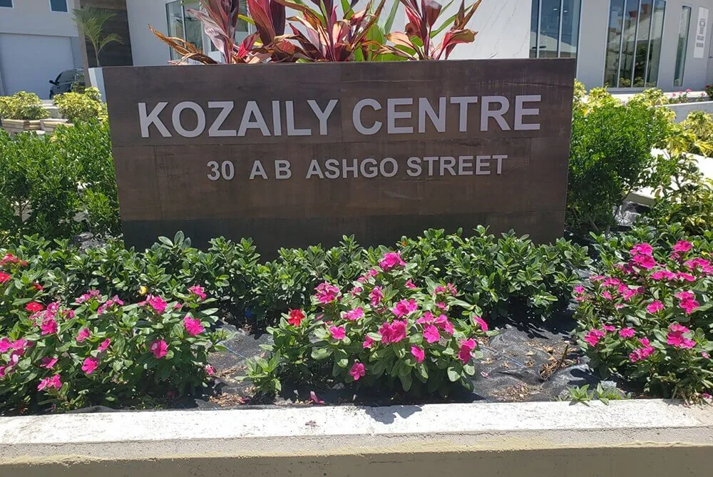 Building-mounted dimensional lettering &mdash; installation is a major share of business sign cost
