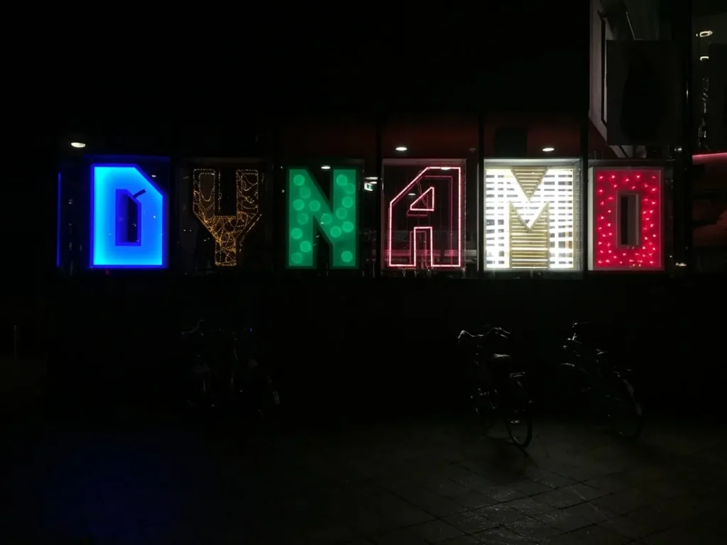 Illuminated channel letter signs on an Austin storefront at dusk